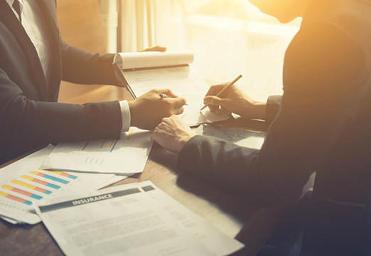 insurance employees next to paperwork